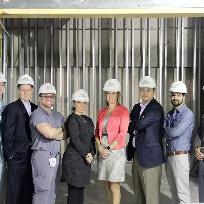 AdventHealth employees posing at a construction site