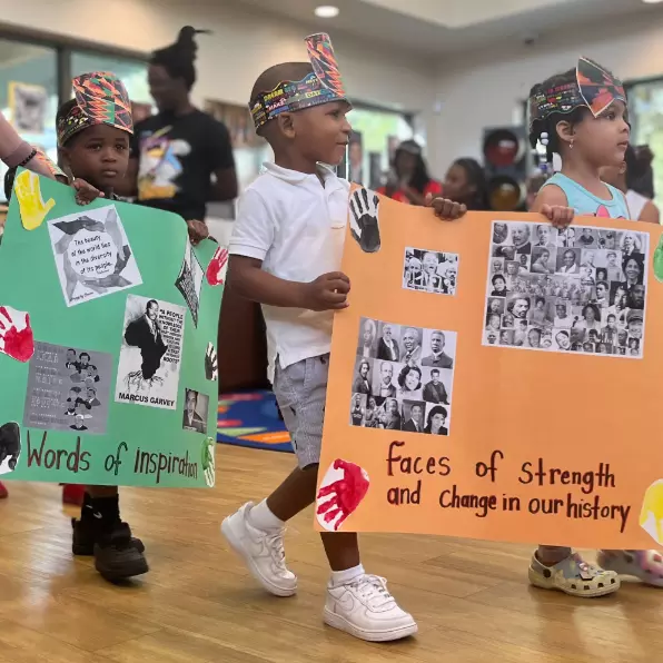 Kids participate in AdventHealth for Children's West Lakes ELC parade honoring Black history heroes.
