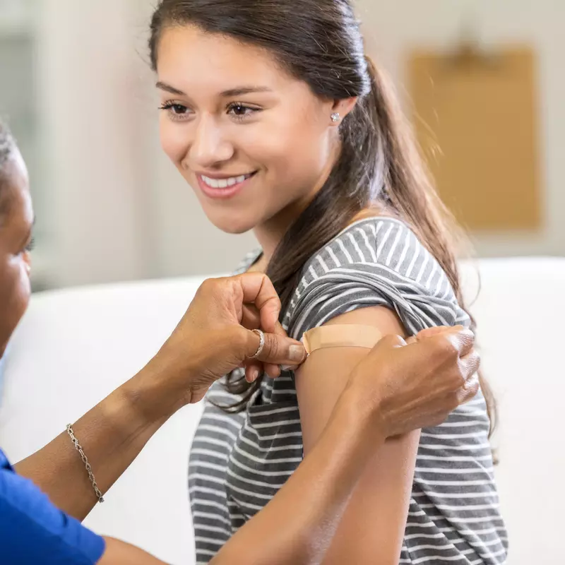 A woman receiving a vaccination 