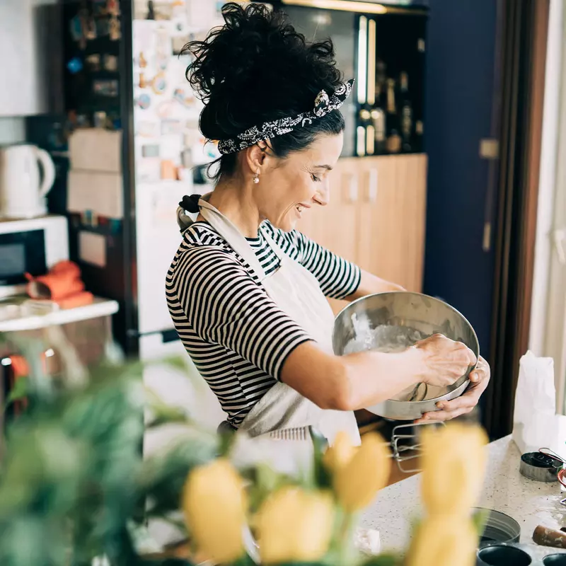 A woman cooking.