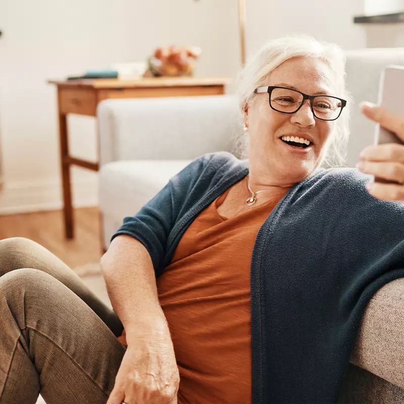 Woman taking a selfie with her living room.