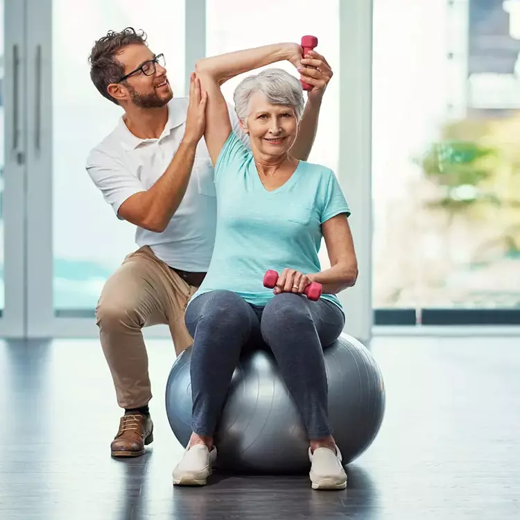 Physical therapy aide with a patient