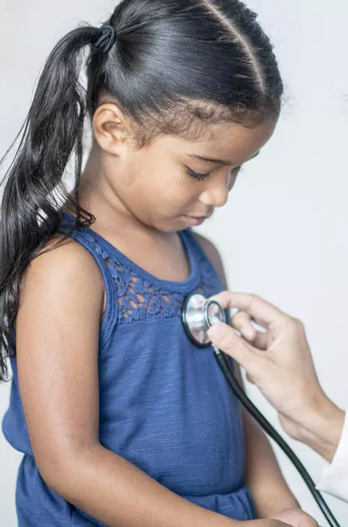 Little girl at doctor stethoscope
