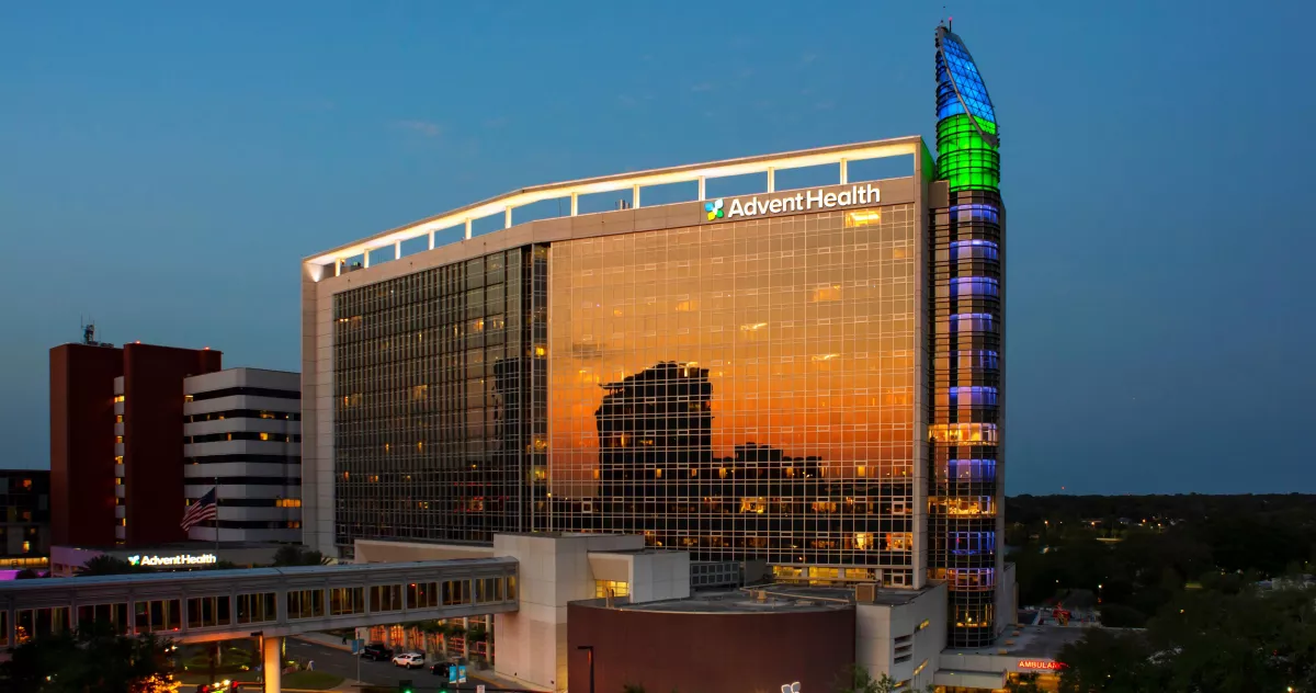 AdventHealth Orlando exterior in the evening.