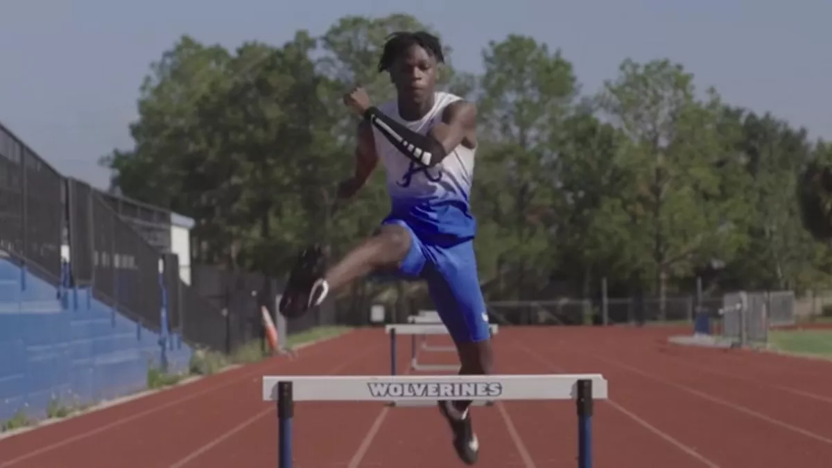 Antonio Parker, running hurdles.