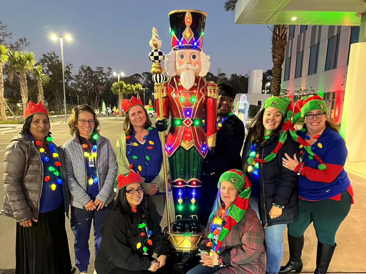 AdventHealth Riverview team members celebrate Lighting the Way, a drive through holiday event supporting ECHO.