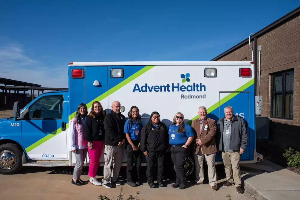 Faculty, superintendents and AdventHealth Redmond EMS gather to celebrate the new ambulance
