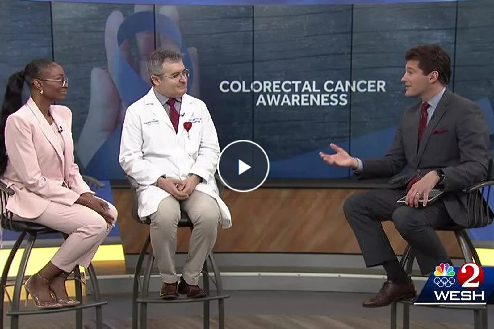 Colorectal cancer survivor Erin Susino appears on WESH 2 News with Dr. Hernan Lopez-Morra, her gastroenterologist, to advocate for early screening.