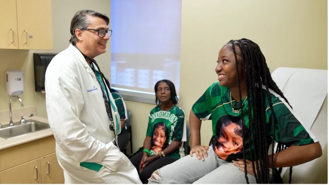 Jermila Pompey, and her family, with Dr. Michael Angelis, at AdventHealth Transplant Institute.