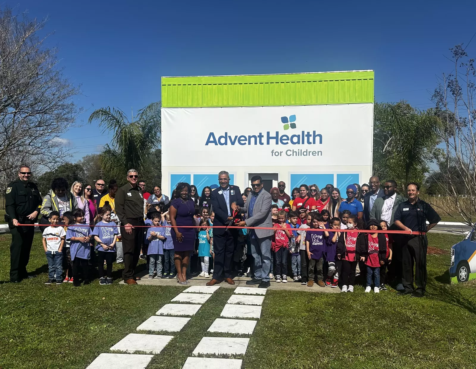 AdventHealth for Children and students from Arbor Ridge School cut the ribbon on a mini "hospital" in the Children's Safety Village.