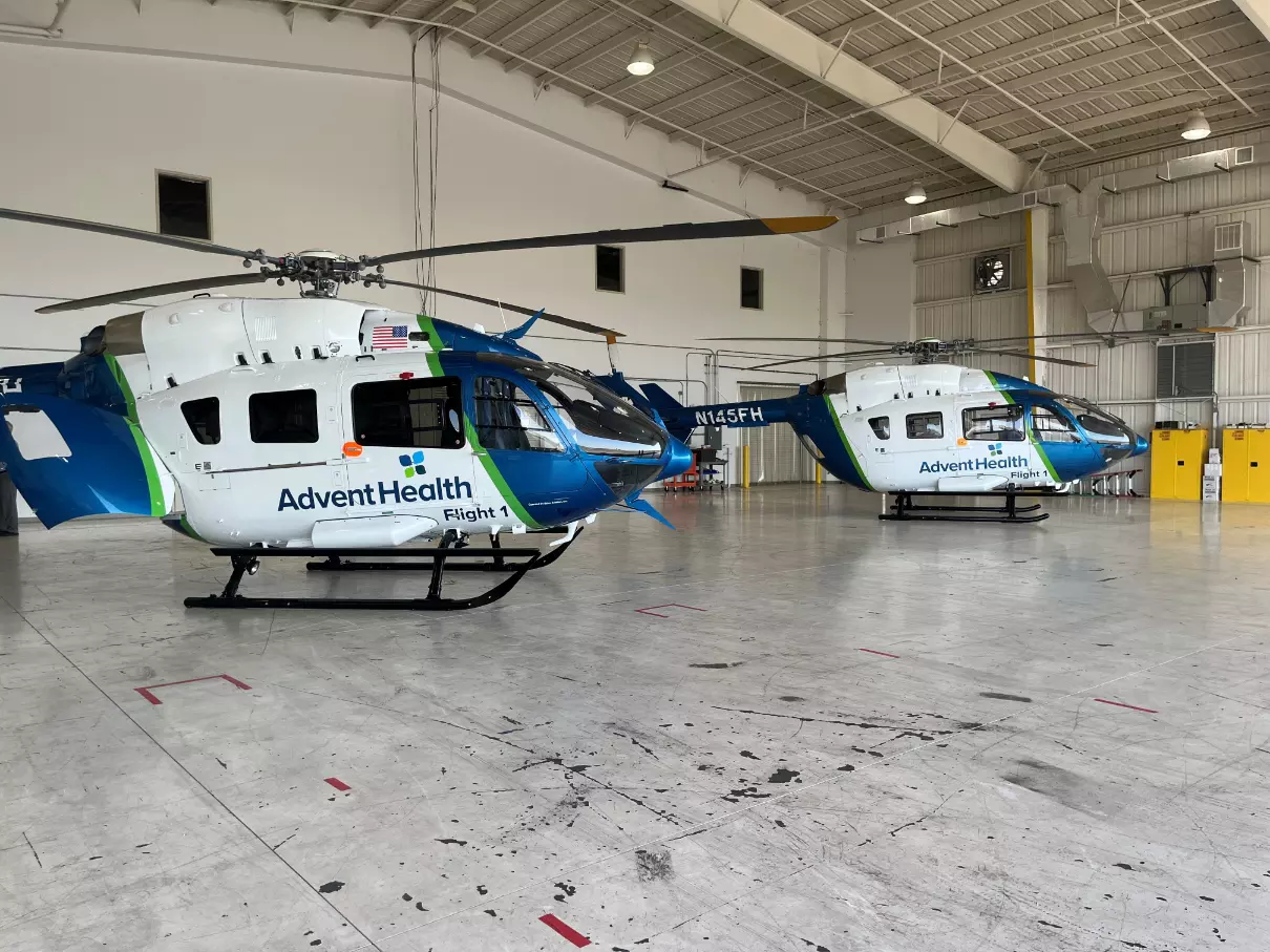 AdventHealth's two rescue helicopters at the hospital system's new hangar at the Orlando Executive Airport.