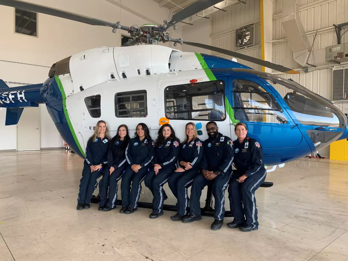 AdventHealth flight nurses and respiratory therapists gather for the unveiling of the hospital system's second rescue helicopter and new hangar at the Orlando Executive Airport.