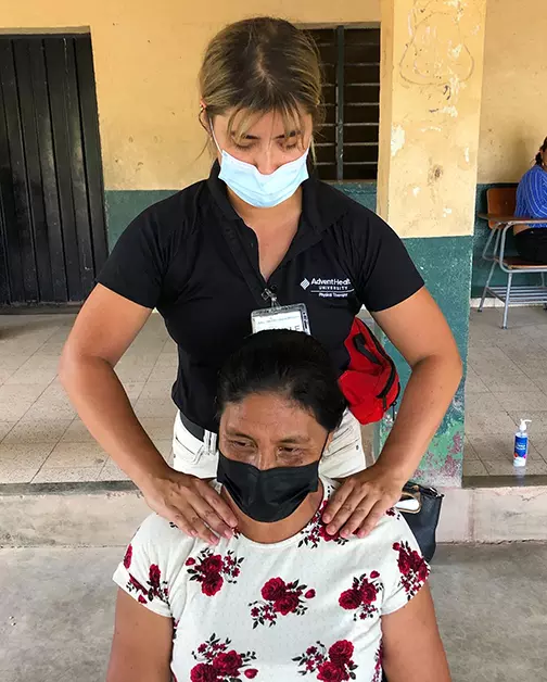 Physical therapy student Danielle Palmer treats a patient in Honduras.