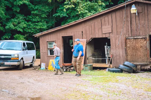Kody Hill works on barn