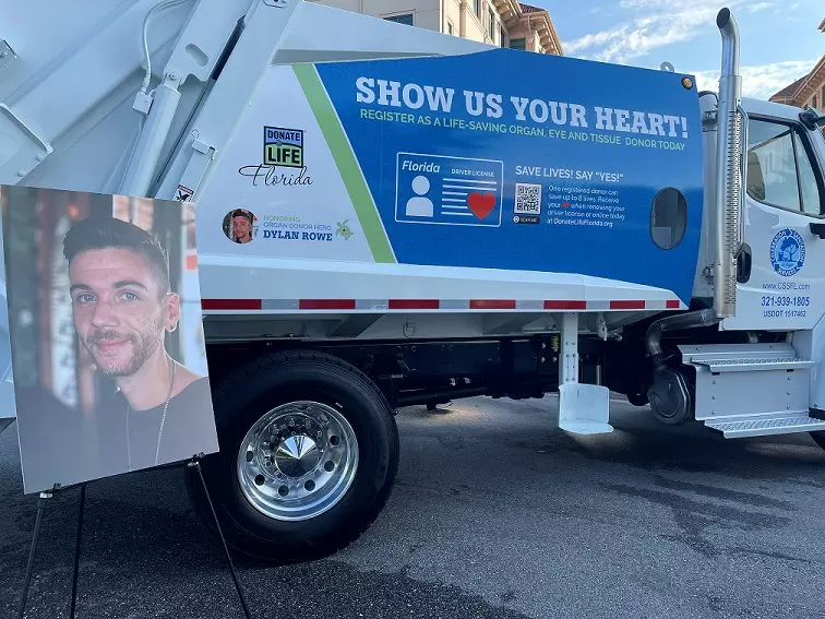 Celebration family honors son’s life-saving organ donation with memorial tribute and public education message on the latest Celebration Sanitation service truck