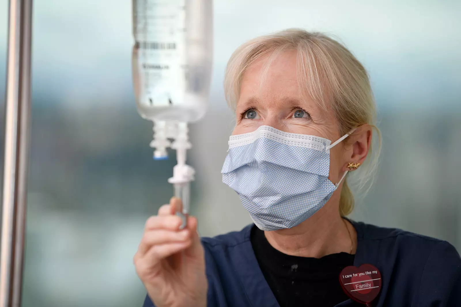 An AdventHealth nurse modifying an IV pouch