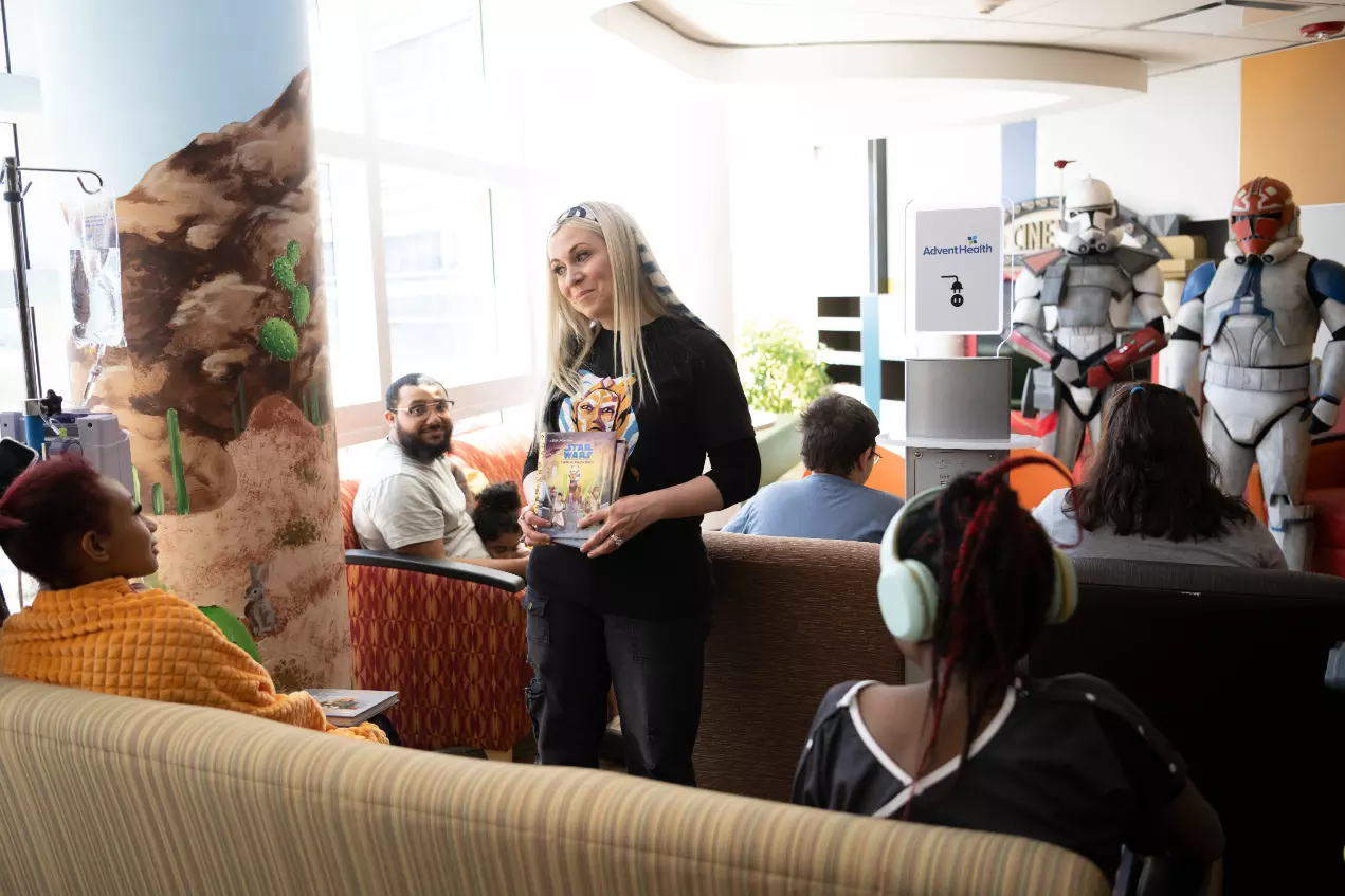 Ashley Eckstein, voice of voice of Star Wars’ Ahsoka Tano, reads to patients at AdventHealth for Children.