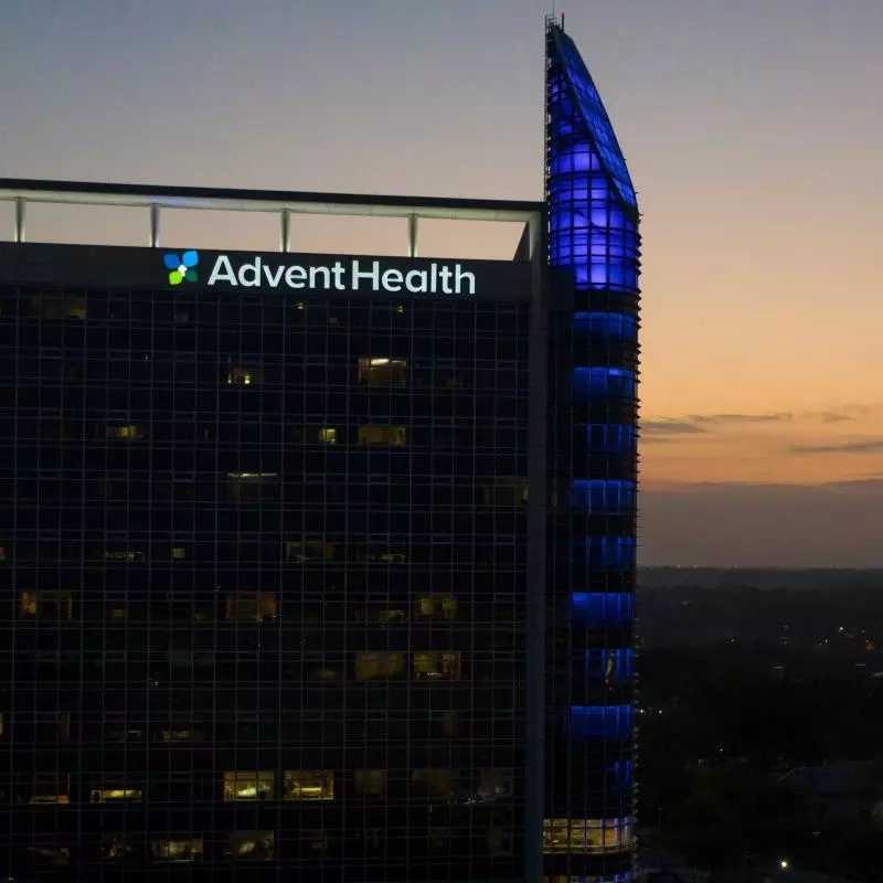 AdventHealth Orlando is lit in blue for Hope Shines On, honoring those impacted by the pandemic.