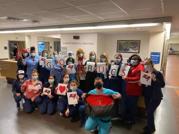 A team of AdventHealth workers showing their support for the Tampa Bay Buccaneers