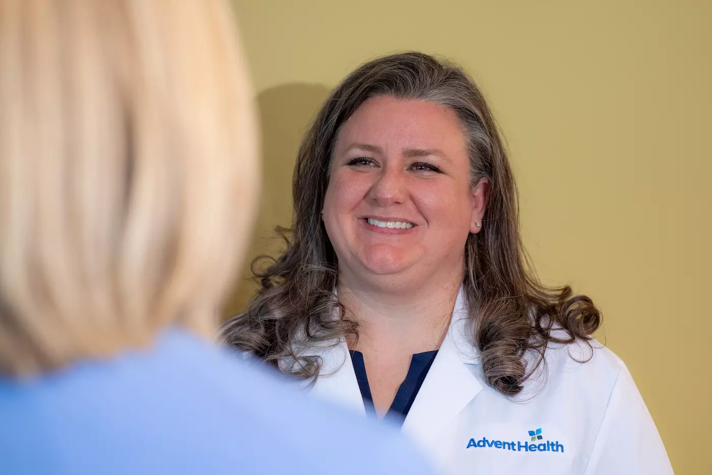 Christina Douglass, MD speaks with a patient
