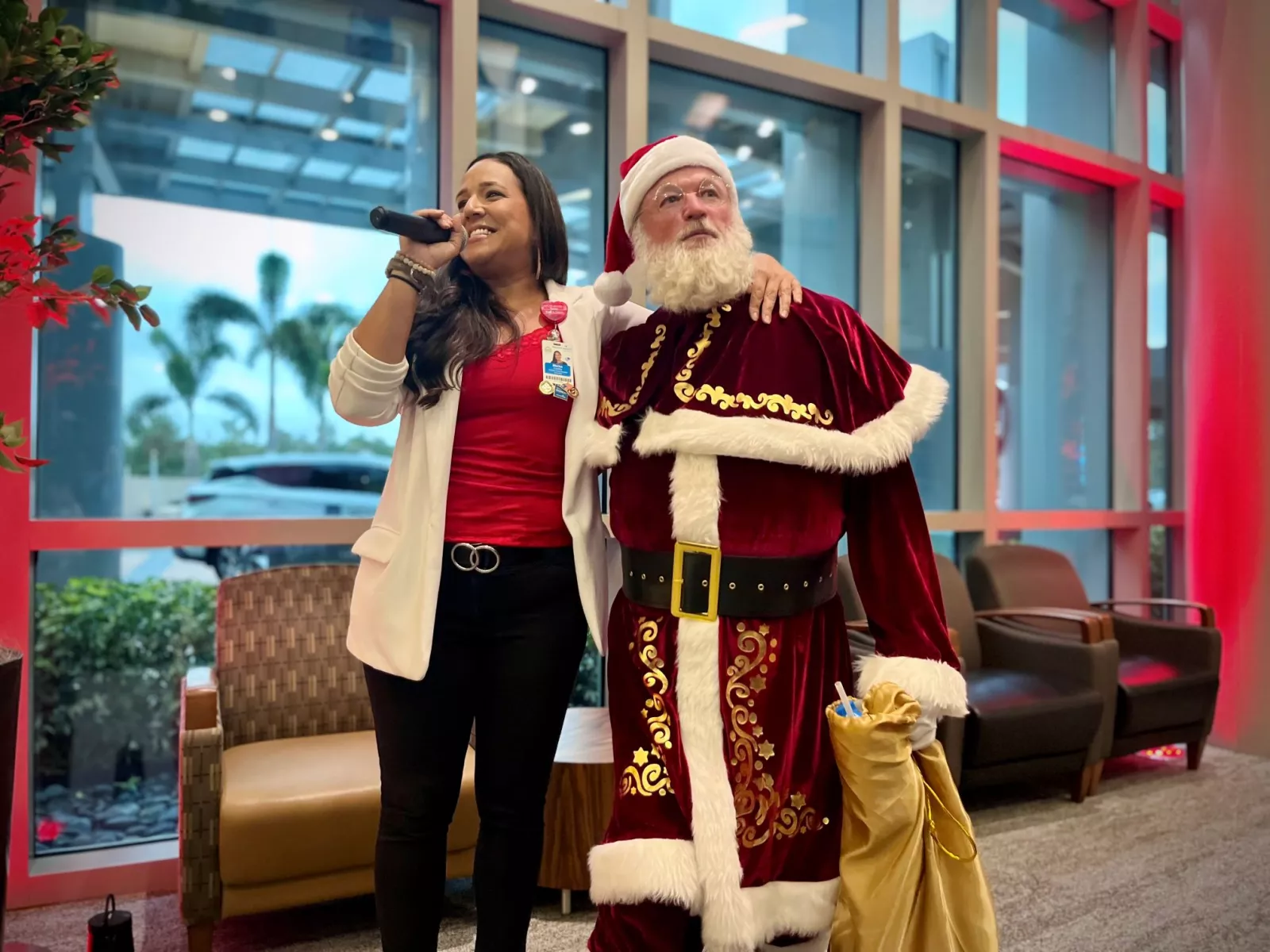 AdventHealth's Christmas by the Piano Celebration featuring Marisa Castillo, a team member at AdventHealth Zephyrhills, performing "The Man with the Bag" alongside Santa Claus!