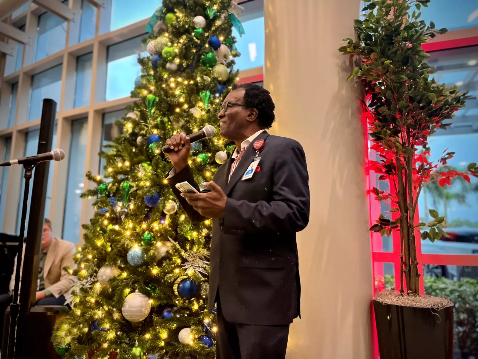 AdventHealth's Christmas by the Piano Celebration at AdventHealth Tampa Chaplain Moses Brown singing "Go Tell it on the Mountain."