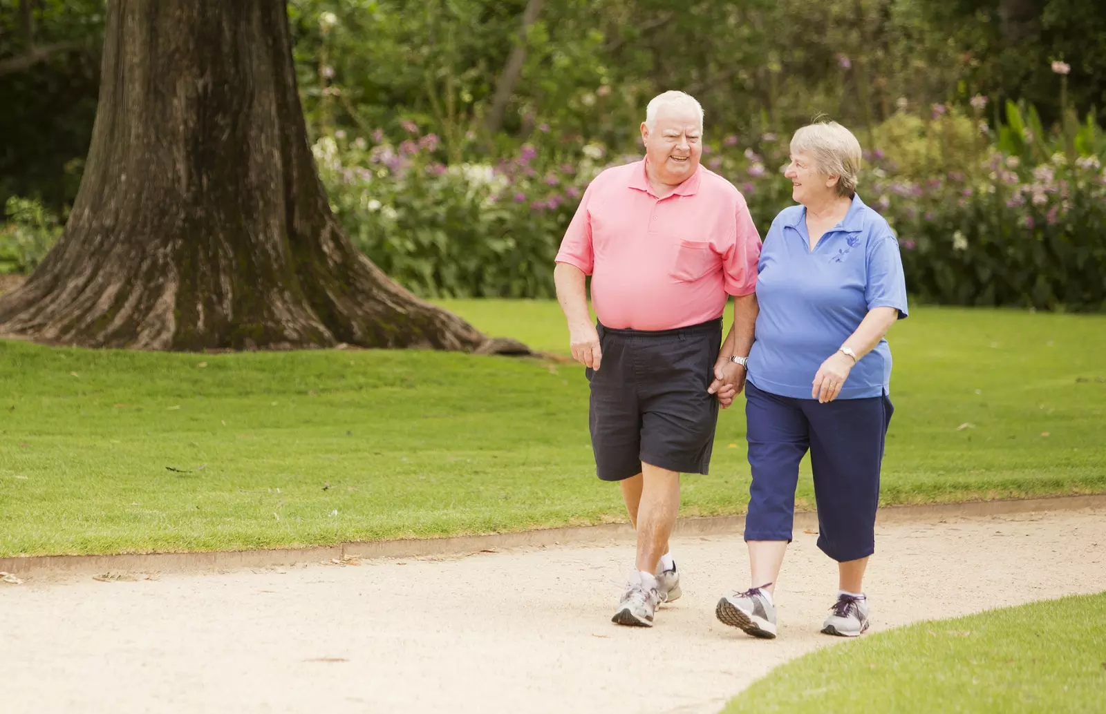 A senior couple walking outdoors