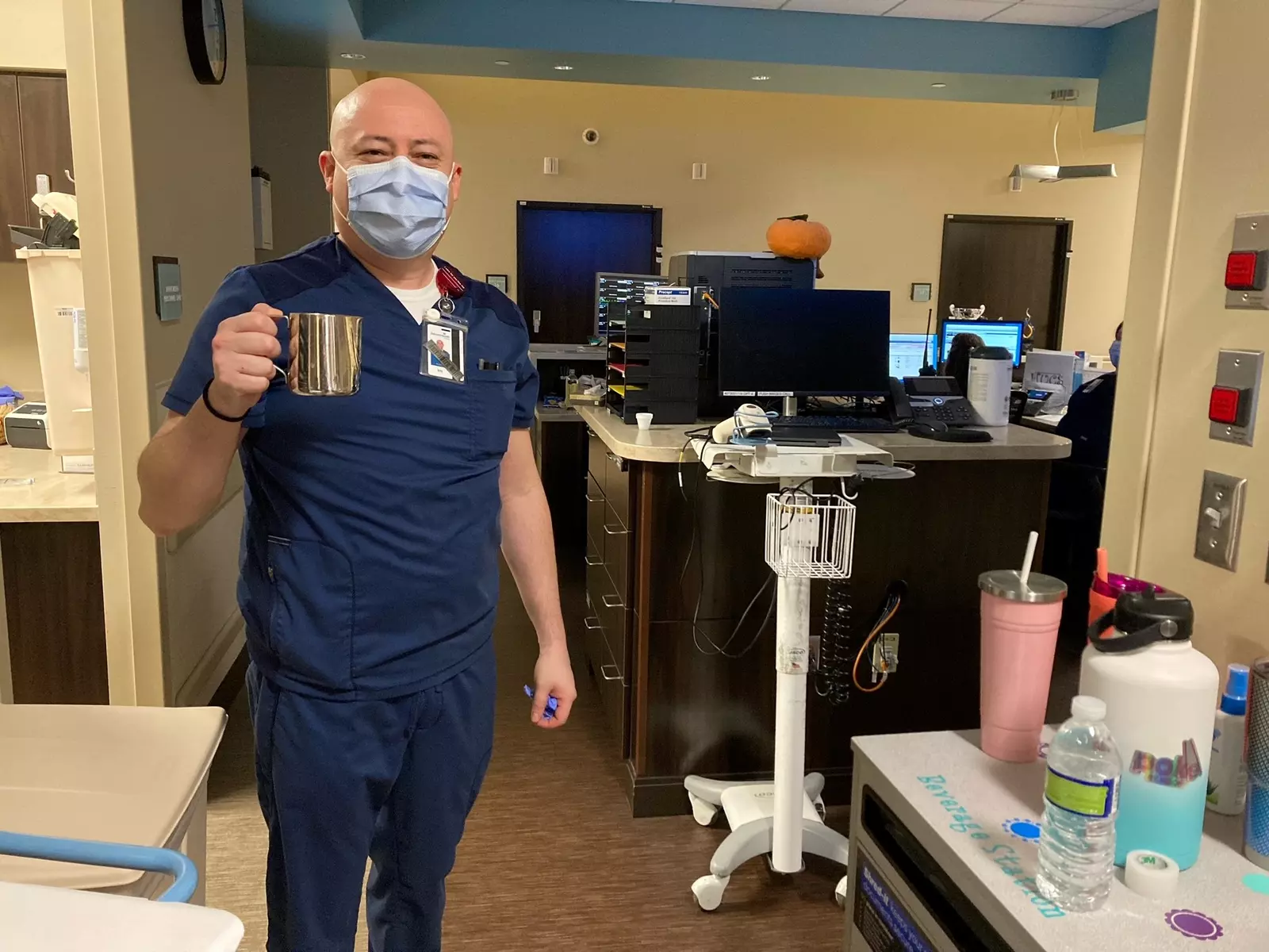 Christian Guerrero, RN, shares cafecito with his fellow nurses in the ER.
