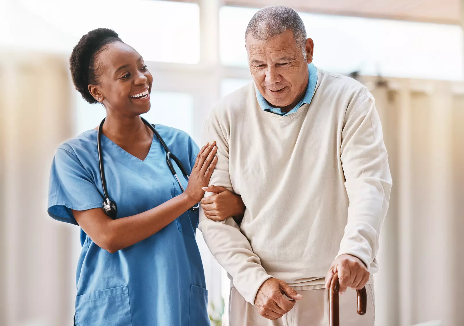 Help, support and medical with nurse and old man and cane for retirement, rehabilitation or healing. Empathy, physical therapy and healthcare with patient and walking stick in caregiver nursing home - stock photo