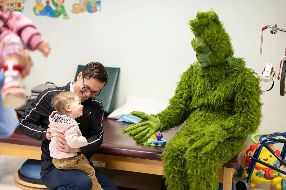 The Grinch visits AdventHealth Ocala Pediatric Rehab