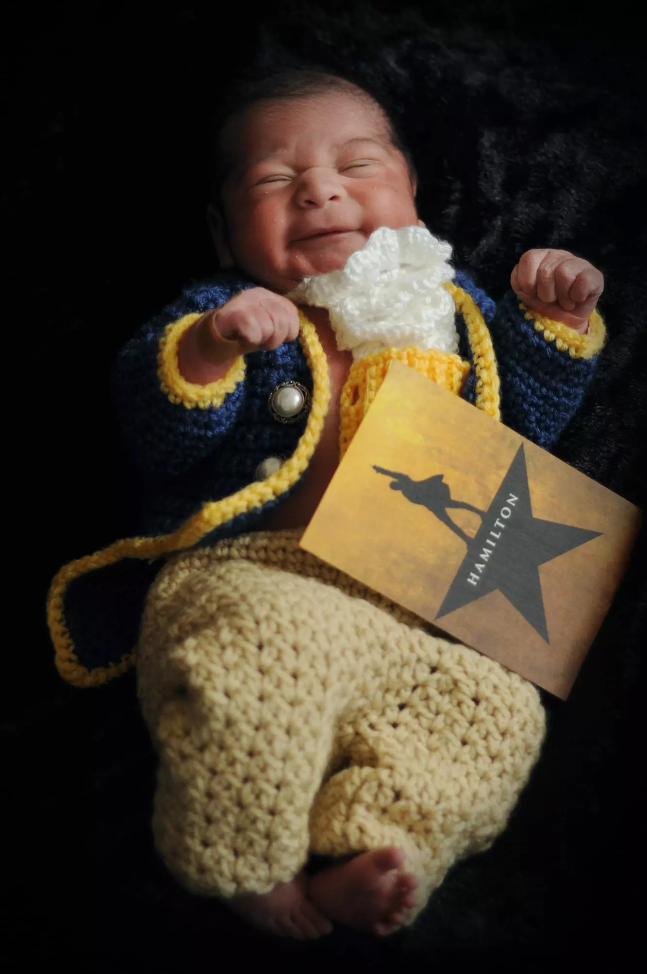 Baby dressed as Hamilton from the musical