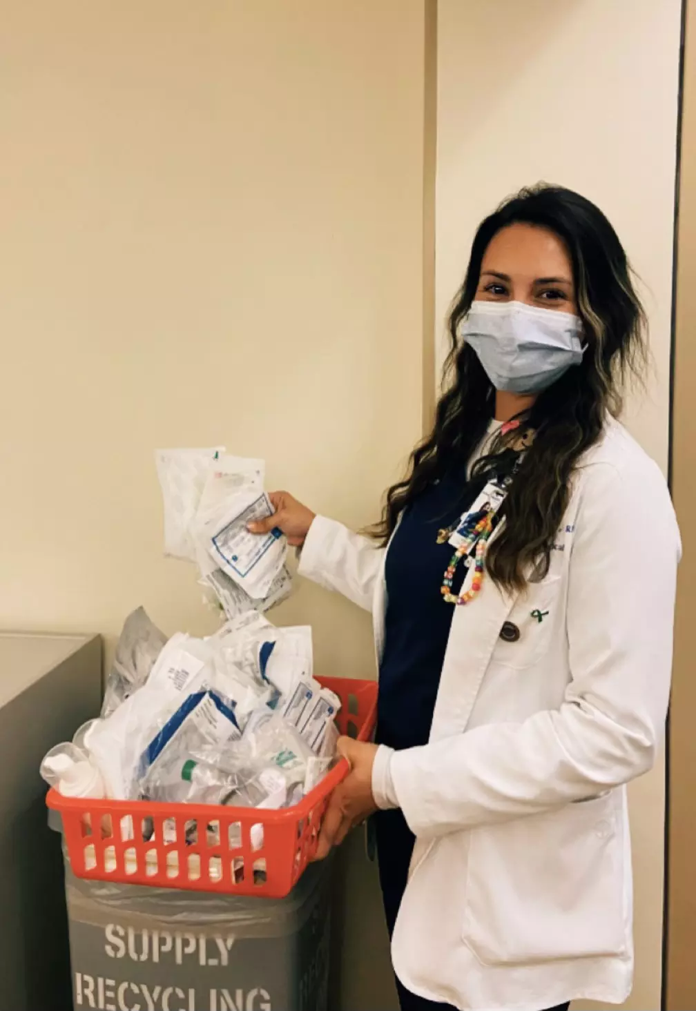 Cassandra Joseph, assistant nurse manager at AdventHealth Orlando holding recycled supplies