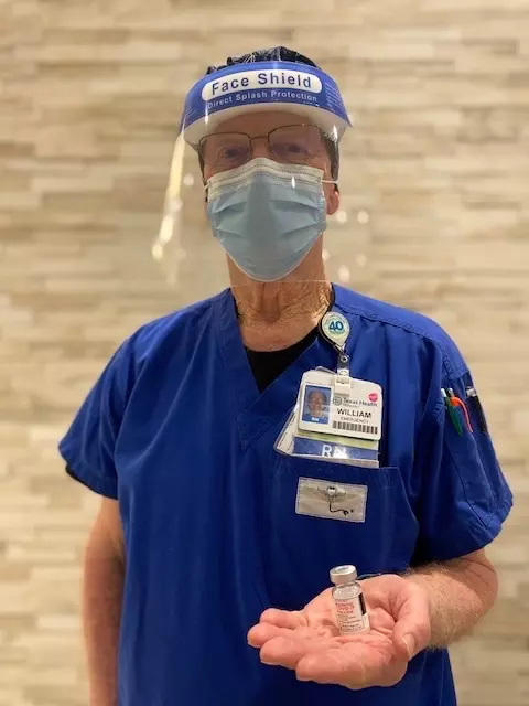 Bill Washburn, 76, RN, has worked at Texas Health Huguley Hospital Fort Worth South since it opened in 1977. Today, he helps administer COVID-19 vaccines at the onsite clinic.