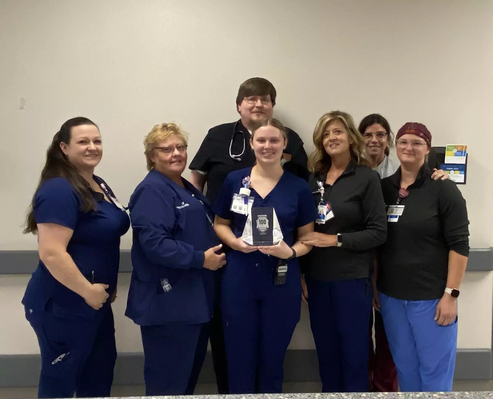 The emergency department team gathers to celebrate the 100 Top Hospital award. Left to right: April Springfield, RN, Pati Kelley, RN, Dax McKay, MD, Savannah Nix, RN, Tammy Bagley, RN, Yolanda Moyer, RN, and Rebecca Cline, PCT.