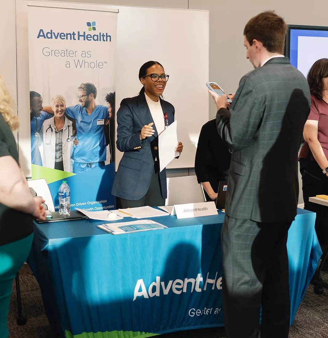 A Jobs Partnership client meets with a prospective employer at a recent job fair.