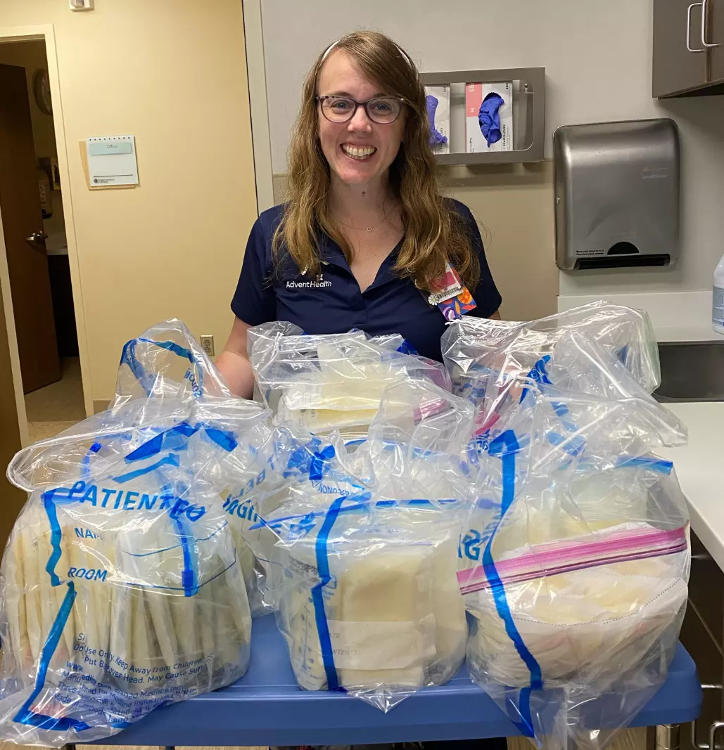 Laura Baran, a NICU nurse educator, with some of the breastmilk she donated.