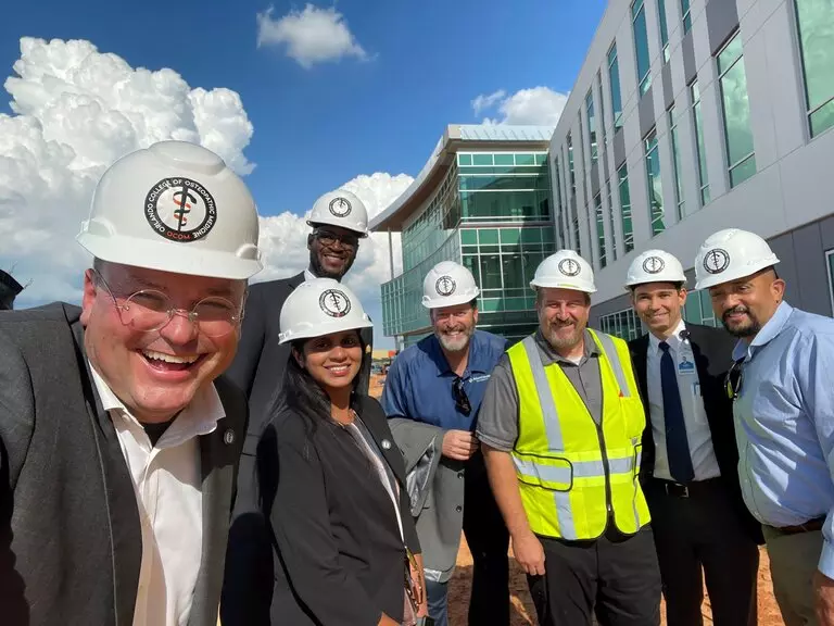 Dr. Robert Hasty, dean and chief academic officer for the new Orlando College of Osteopathic Medicine, gives a personal tour of the new facility going up in Winter Garden to AdventHealth University leaders.