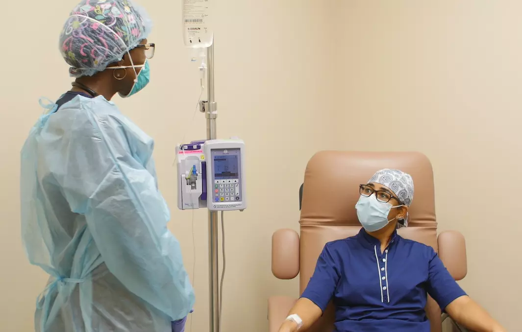 clinical employee speaks to a patient reviving a bamlanivimab infusion in Ornage City