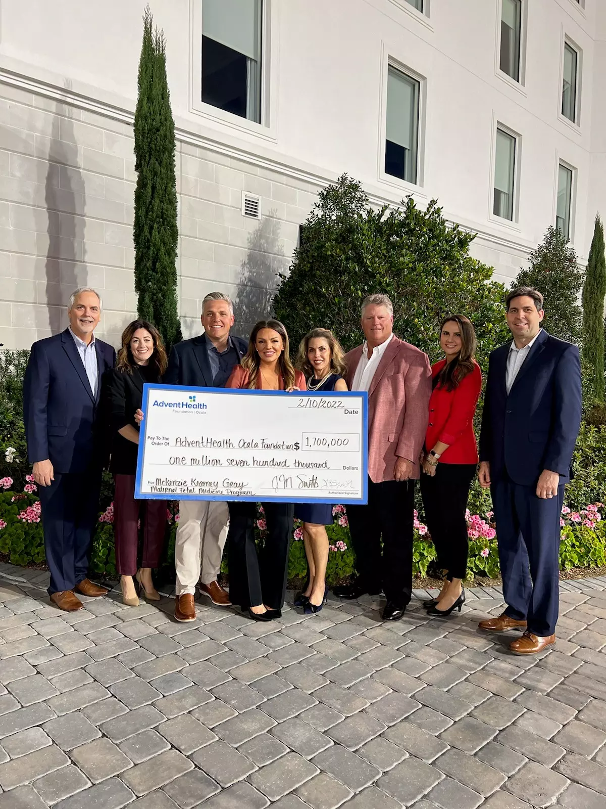 Group photo of check donation to AdventHealth Ocala