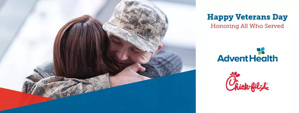 a soldier hugs a family member