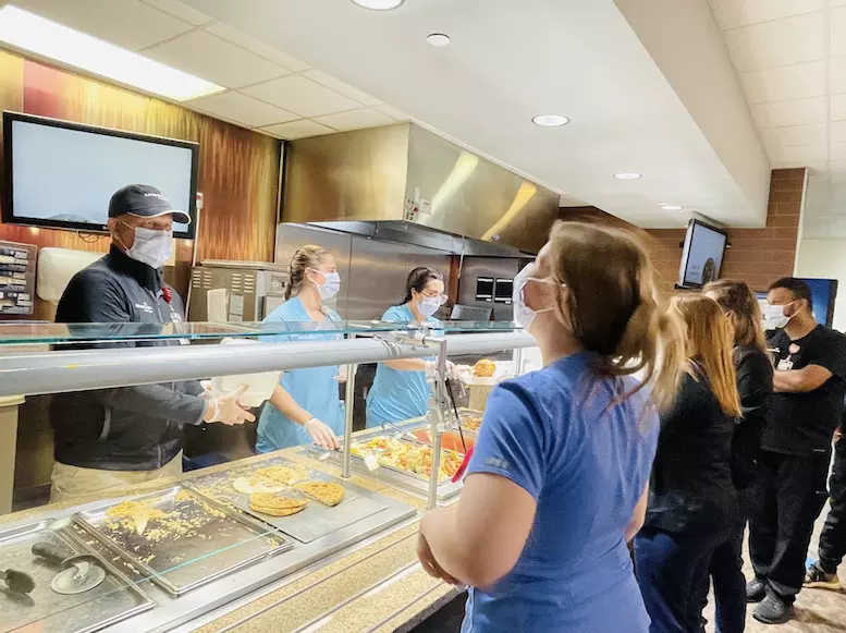 AdventHealth hospital CEOs helped prepare meals for hospital staff at a time when the cafeteria needed extra support.